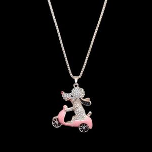 Unsigned Rose Gold-Tone White Rhinestone Dog on Pink Enamel Scooter Necklace